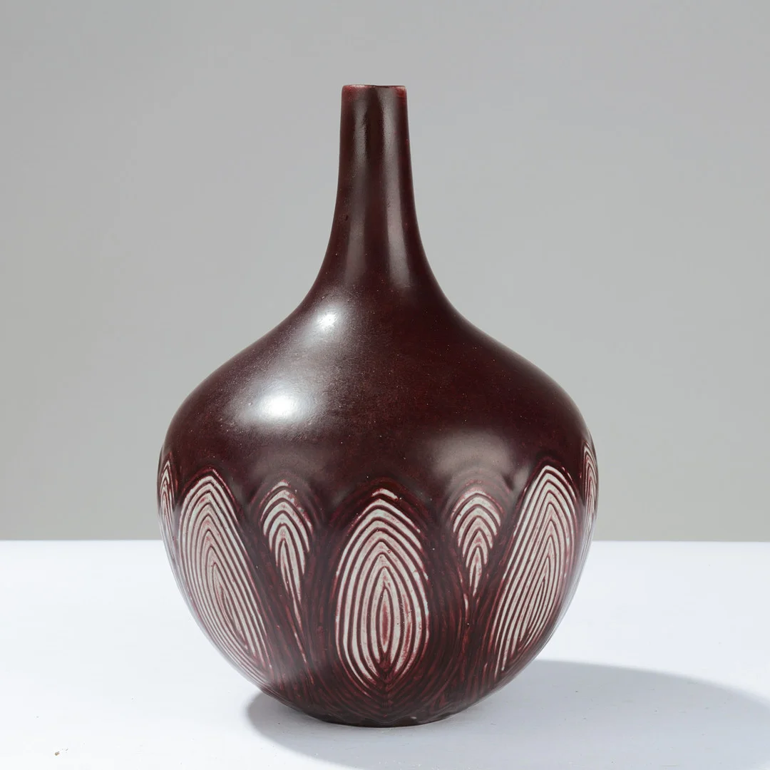 AXEL SALTO. Teardrop-shaped stoneware vase decorated with oxblood glaze and oval reliefs, model no. 20736, designed in 1945, Royal Copenhagen, Denmark. — European — Palsgaard Kunstauktioner