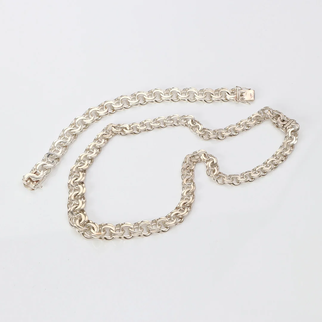 HALS- OCH ARMBAND. Sterlingsilver, bismarcklänkar, totalvikt ca 103,4 gram. — Jewellery Suites — Skånes Auktionsverk