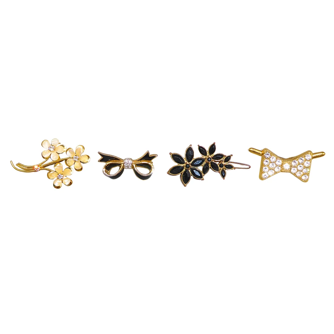 SET AUS BROSCHEN UND HAARSCHMUCK, 4 TEILE. — Brooches & Pendants — Auktionshaus Stuber's Hammerschlag