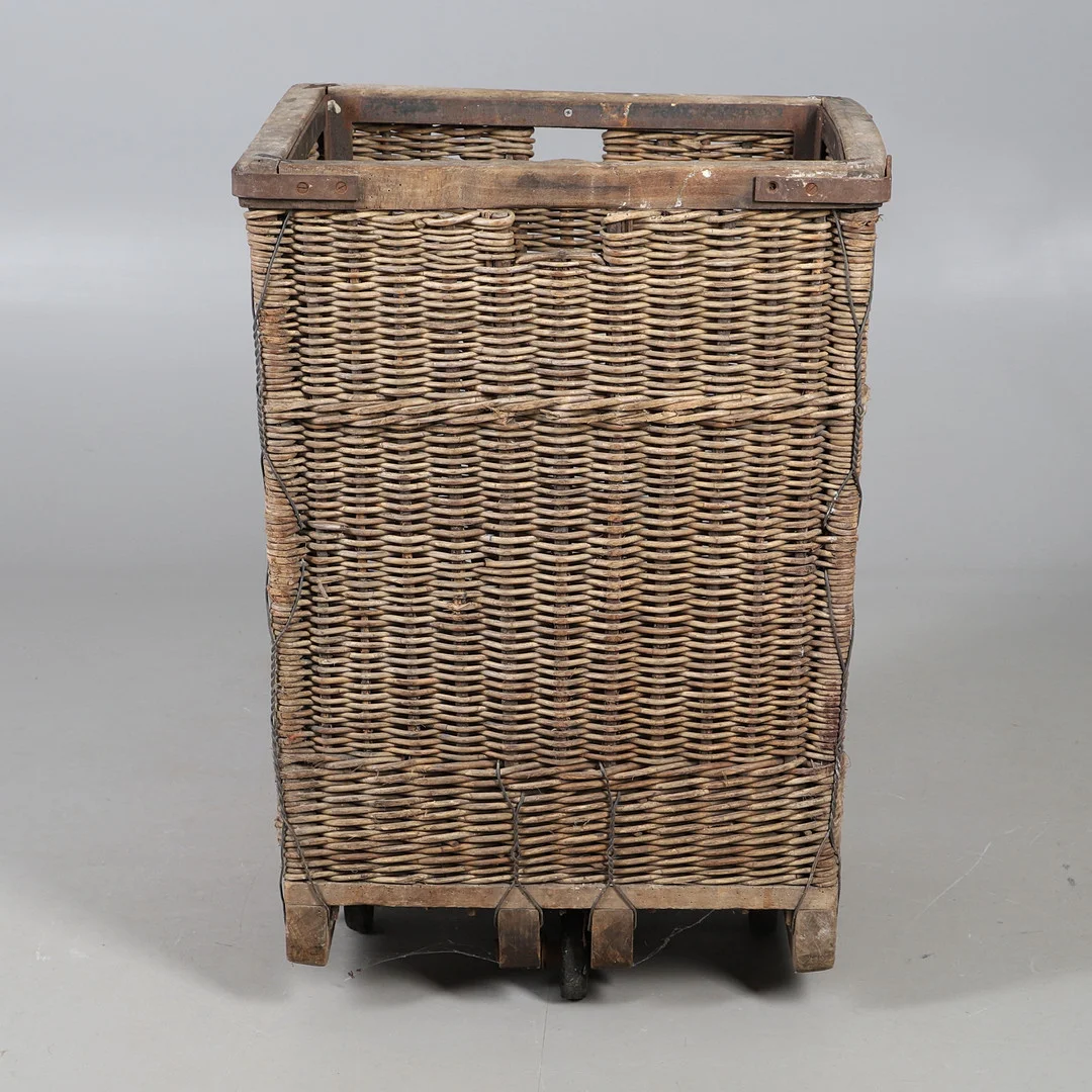 AN EARLY 20TH CENTURY INDUSTRIAL WICKER TROLLEY. — Other — Lawrences Auctioneers