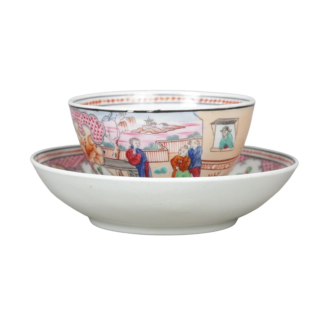 A NEWHALL PORCELAIN "BOY AT THE WINDOW" TEA BOWL AND SAUCER, CIRCA 1810 (2). — European — Bishop & Miller