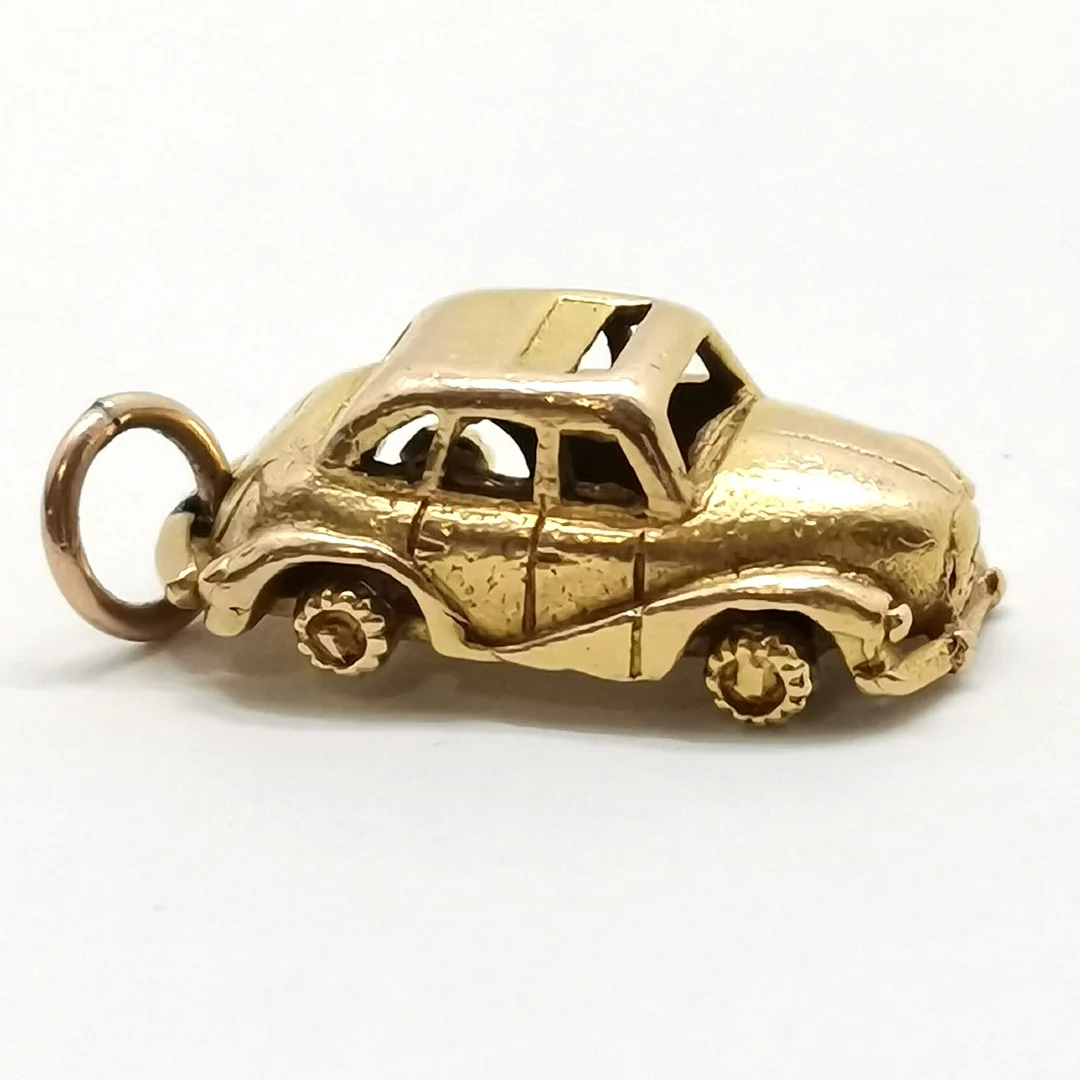 GEORG JENSEN 9CT GOLD CAR W/ MOVING WHEELS PENDANT. — Brooches & Pendants — Acreman St Auctioneers & Valuers