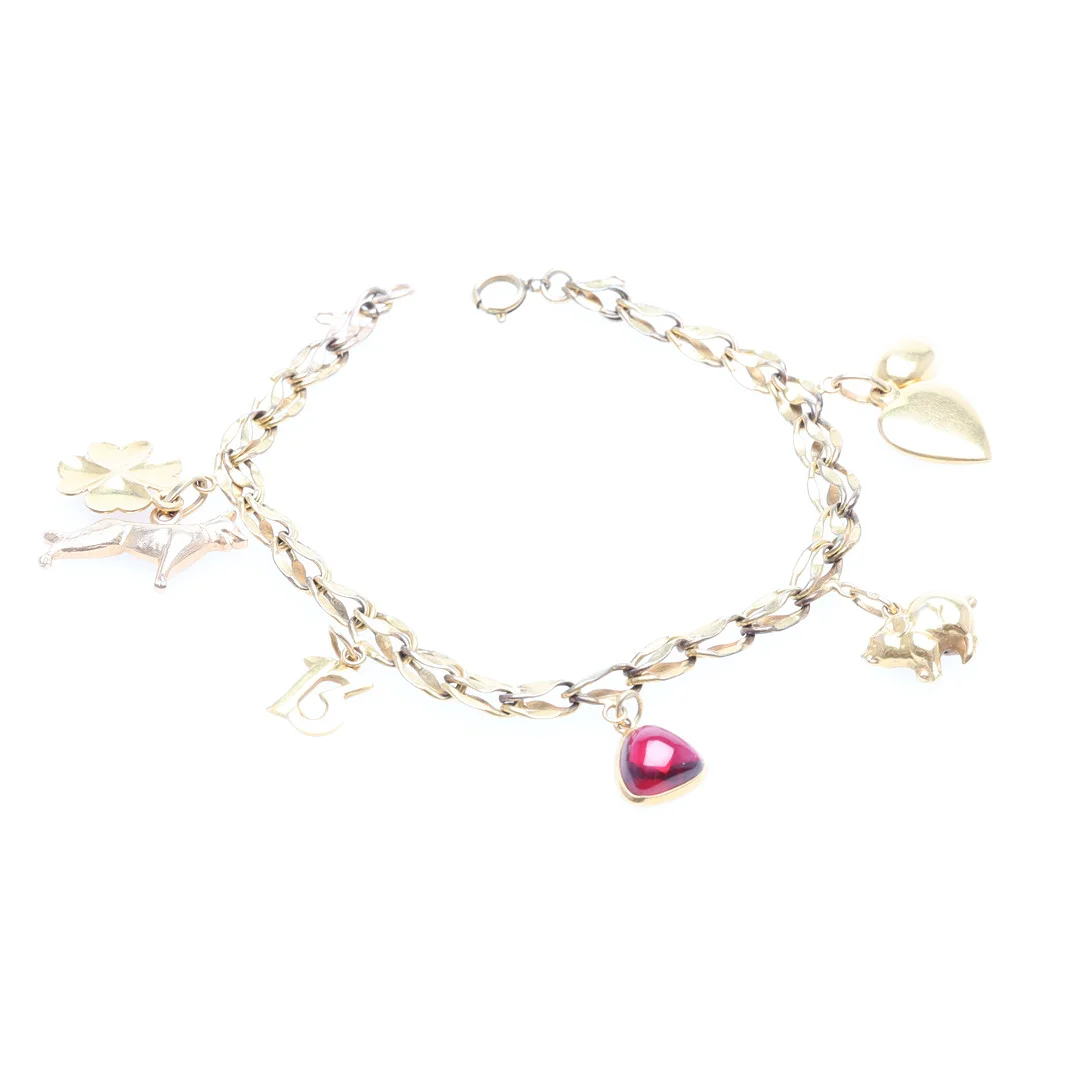 ARMBAND doublé med berlocker i 18K guld bruttovikt 12,3 gram. — Bracelets — Höörs Auktionshall