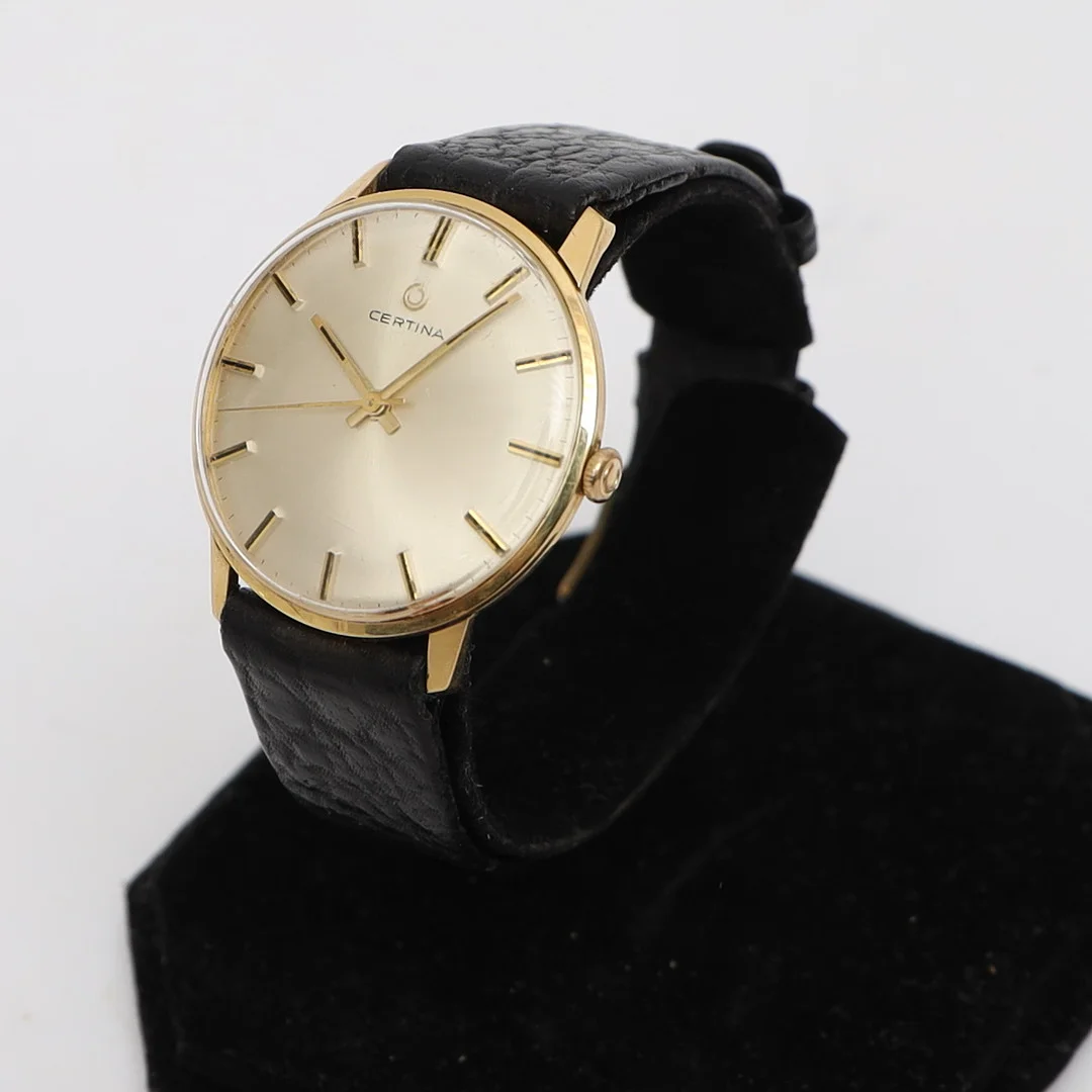 HERRARMBANDSUR, Certina, 14k, guld, med armband av läder, stämplad. — Wristwatches — Falun Auktionsbyrå