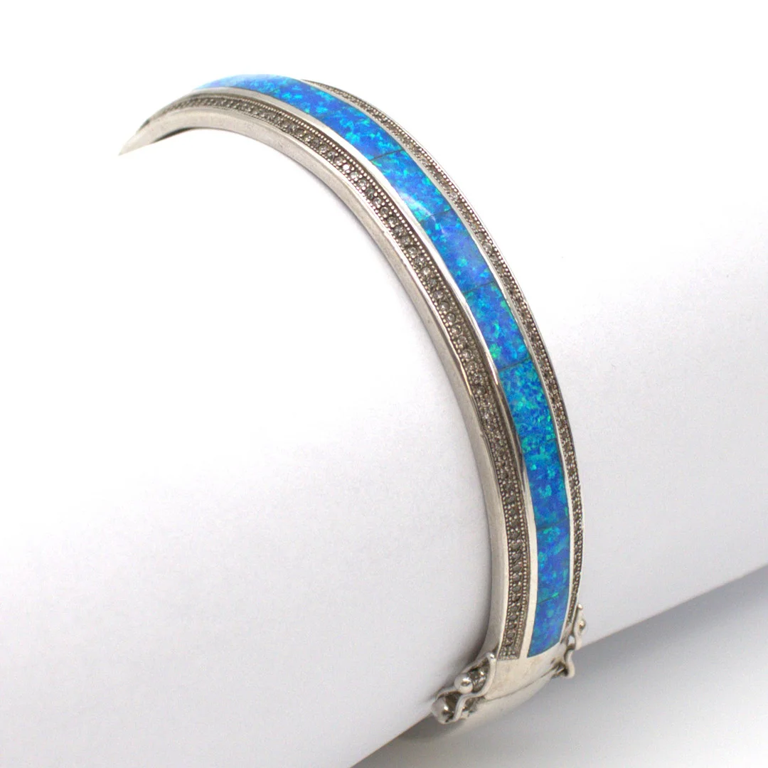 CHRISTIAN&IBANA. VINTAGE ARMREIF STERLING SILBER 925 MIT ZIRKONBESATZ UND OPAL OPTIK INLAY. — Bracelets — Kunst- und Auktionshaus Kleinhenz
