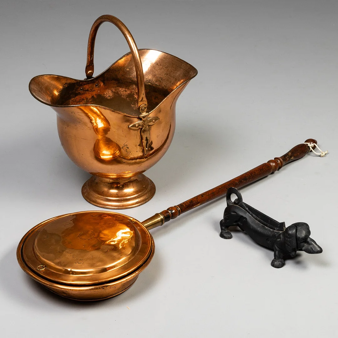 A COPPER HELMET COAL SCUTTLE, A CAST IRON DOG BOOT SCRAPE AND WARMING PAN. — Pewter, Brass & Copper — Griffin’s Auctioneers