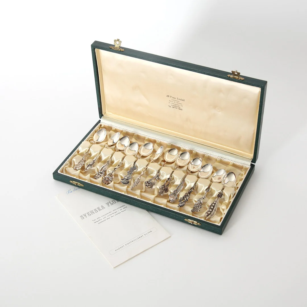 MOCCASKEDAR "Svenska Floran", 12 st, silver, i schatull, GEWE, 1960/70-tal. — Silver — Auktionsverket Engelholm