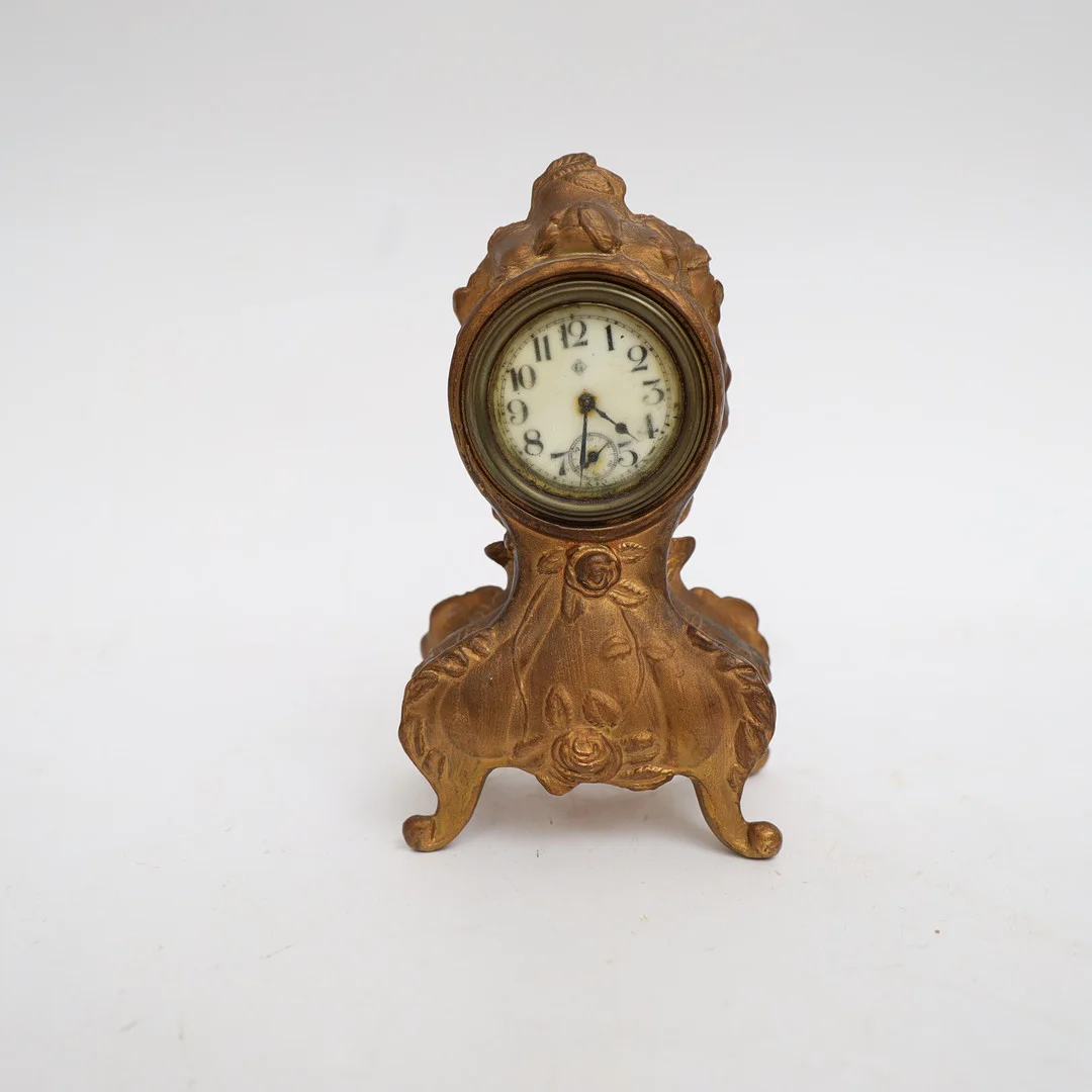 BORDSUR, jugend, tidigt 1900-tal, bronserad metall med rosor i relief. — Mantel clocks — Falun Auktionsbyrå