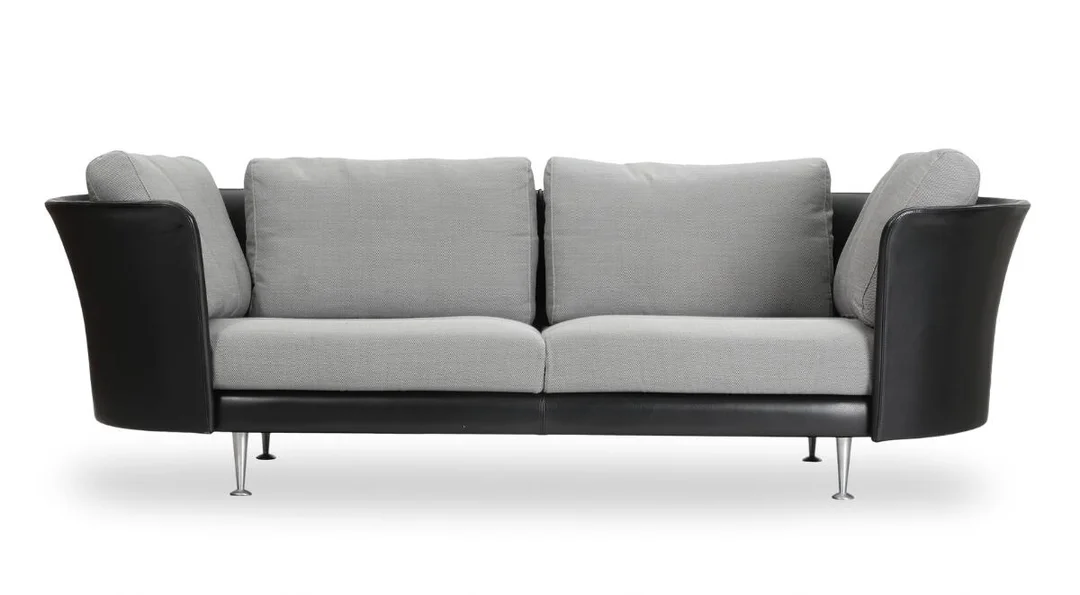 “MH Vascas”. Three seater sofa with steel legs, upholstered with black leather and grey fabric. Manufactured by Mogens Hansen. L. 225 cm. — Modern Furniture — Bruun Rasmussen