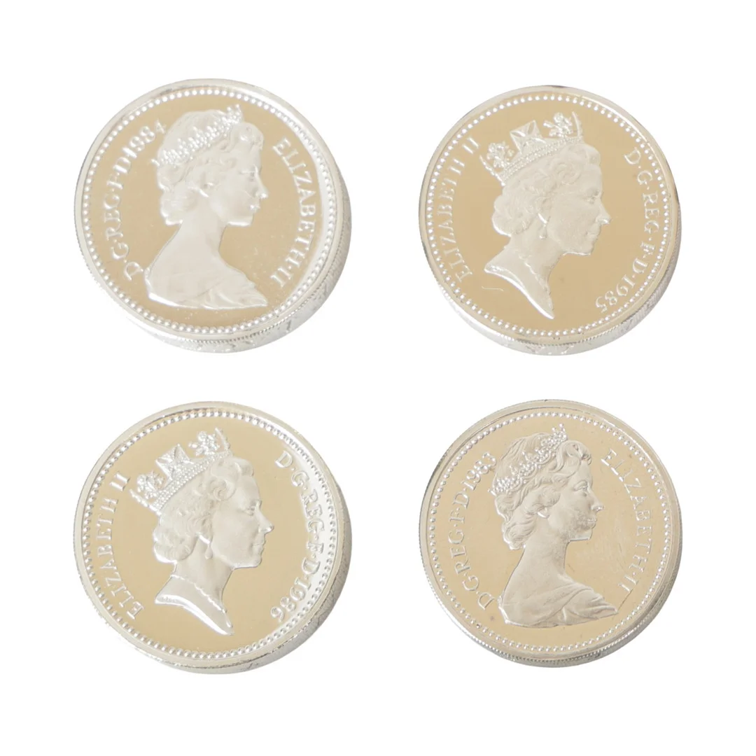 FOUR £1 SILVER PROOF PIEDFORT COINS (4). — Coins & Banknotes — Bishop & Miller