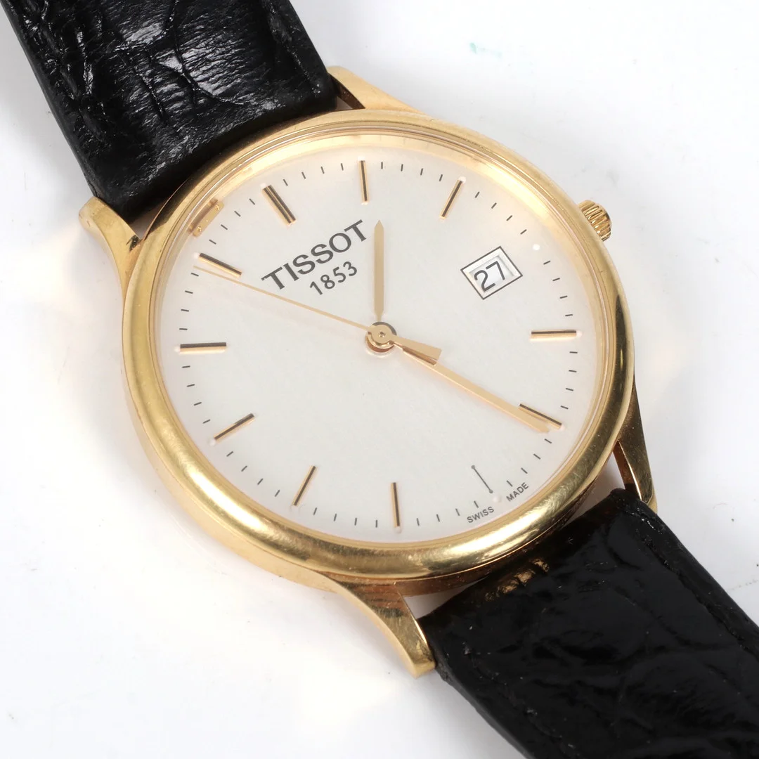 ARMBANDSUR, 18 k guld, Tissot 1853, quartz, med datum. — Wristwatches — Stadsauktion Sundsvall