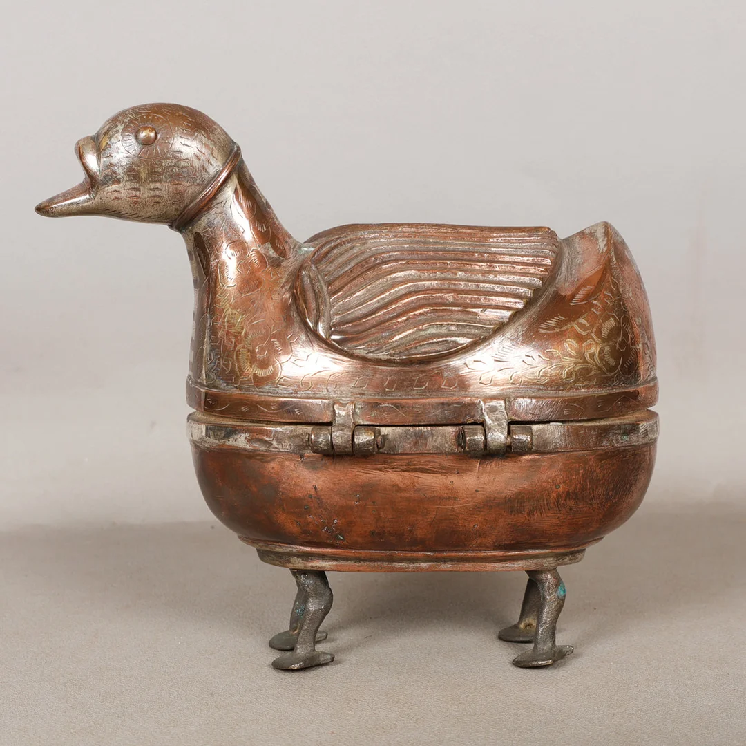 AN INDIAN BETEL NUT BOX IN THE FORM OF A DUCK. — Silver plated — Bishop & Miller