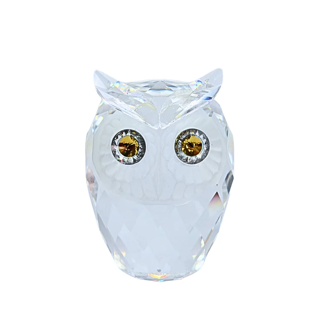 MAX SCHRECK. SWAROVSKI-EULE AUS KRISTALLGLAS MIT GELBEN AUGEN. — Art glass — Auktionshaus Stuber's Hammerschlag