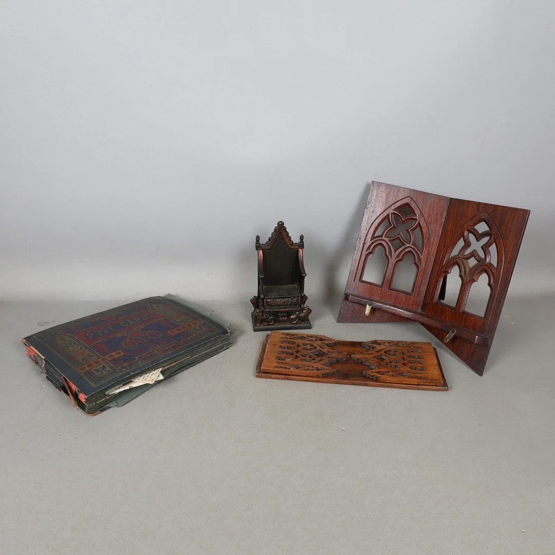 AN EARLY 20TH CENTURY PHOTO AND POSTCARD ALBUM, BOOK END, READING STAND, AND A METAL THRONE (4). — Miscellaneous — Bishop & Miller
