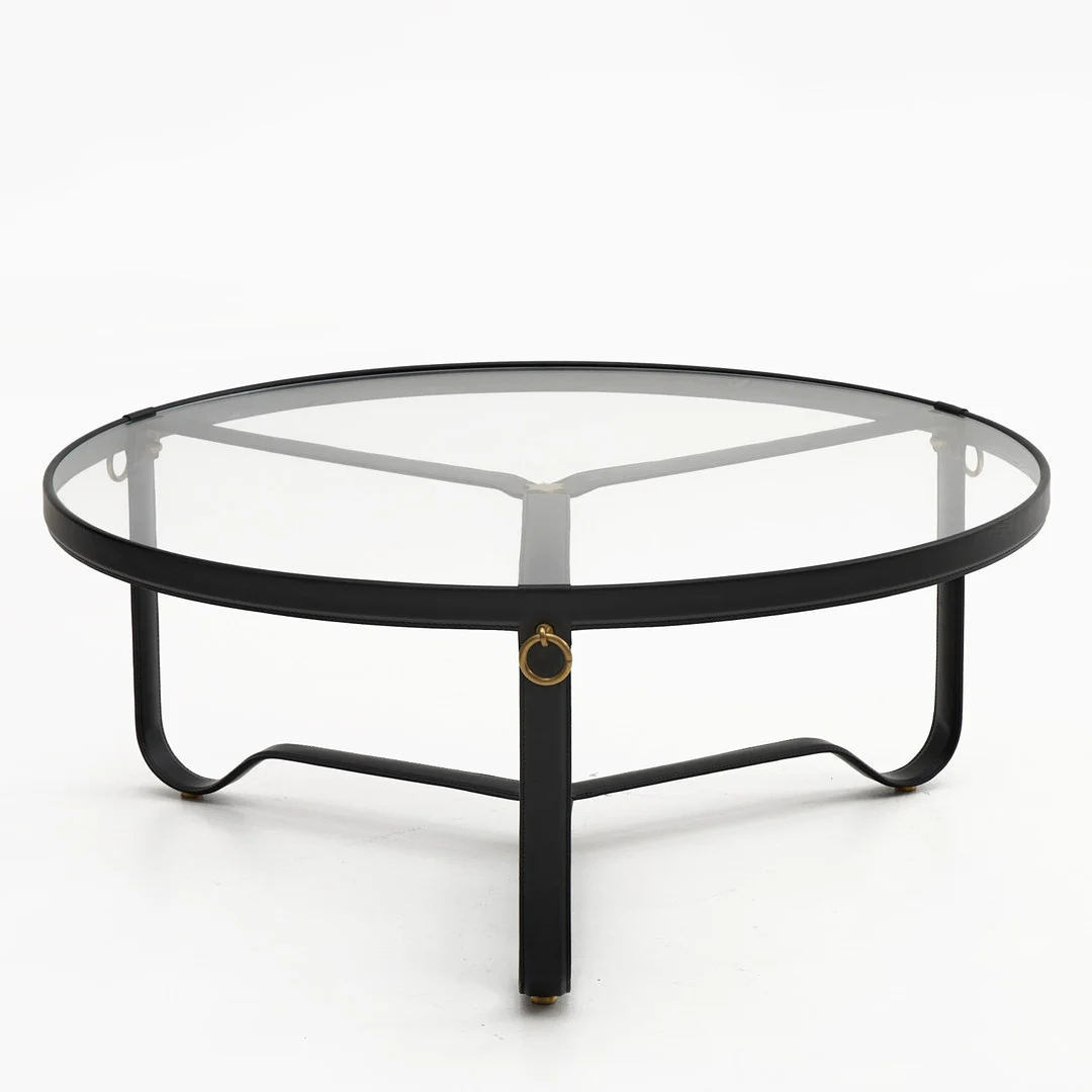 JACQUES ADNET. Soffbord, "Adnet", Gubi, metallstomme klädd i svart läder, skiva i glas, mässingsdetaljer. — Coffee Tables — Crafoord Auktioner Stockholm