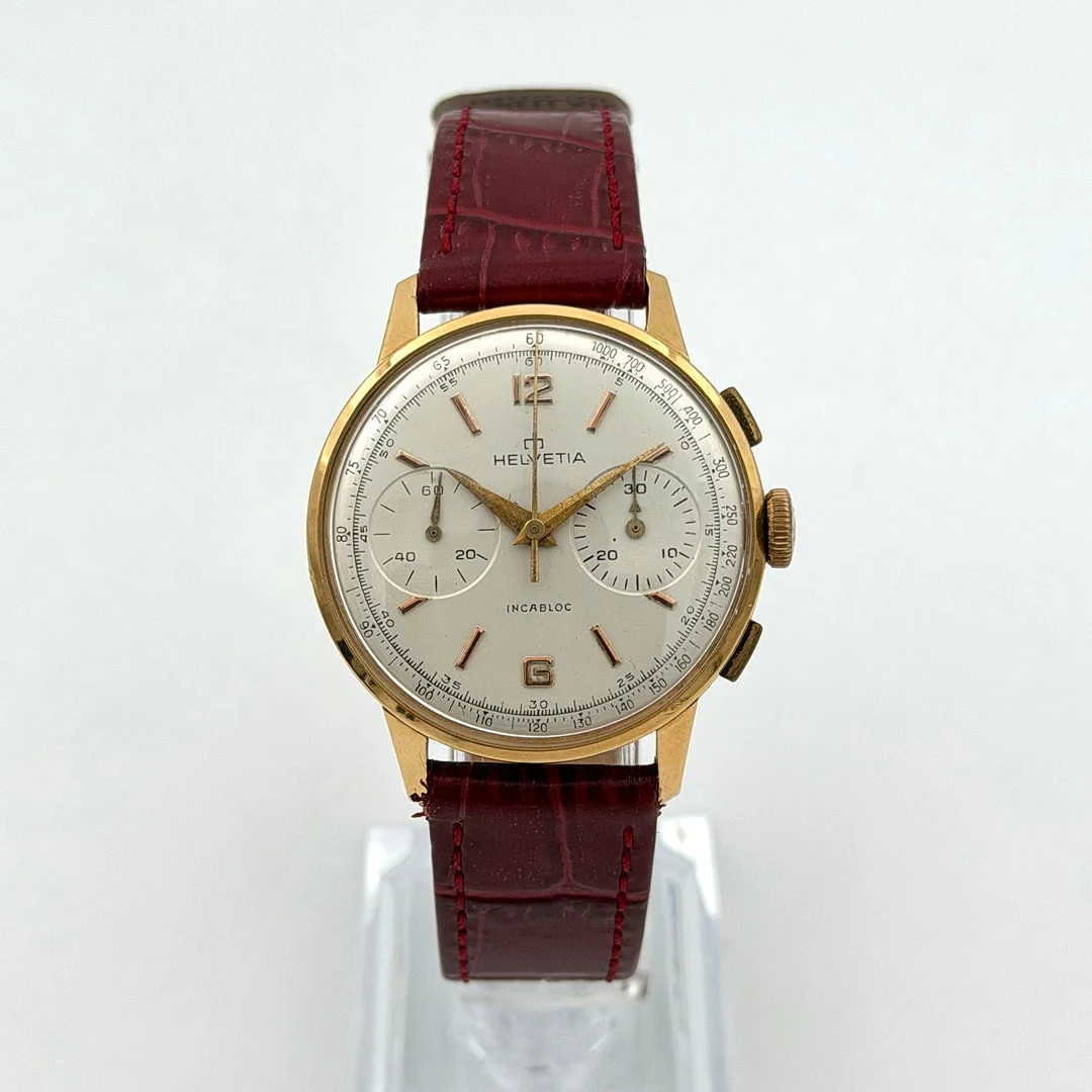 HELVETIA, kronograf, armbandsur, 1950/60-tal, manuell, guld 18k. — Wristwatches — Skandia Auktion