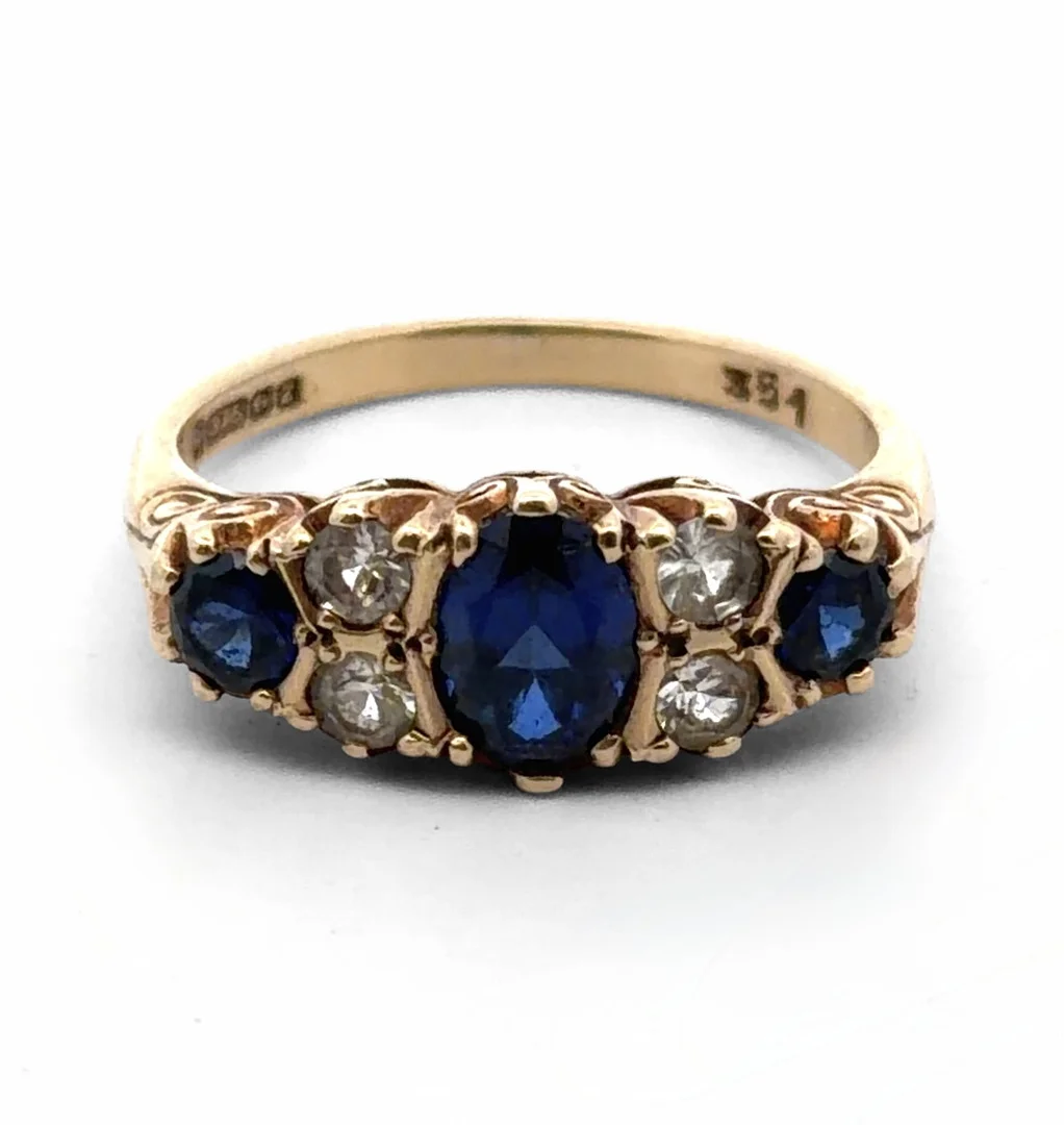 SYNTHETIC SAPPHIRE AND WHITE STONE RING. — Rings — Griffin’s Auctioneers