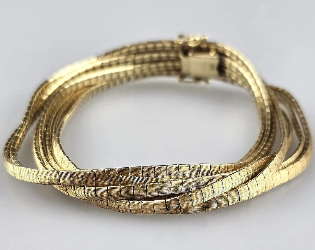 GOLDARMBAND - Italien 1960/70er Jahre, Gelbgold 585/000. — Bracelets — Auktionshaus Blank