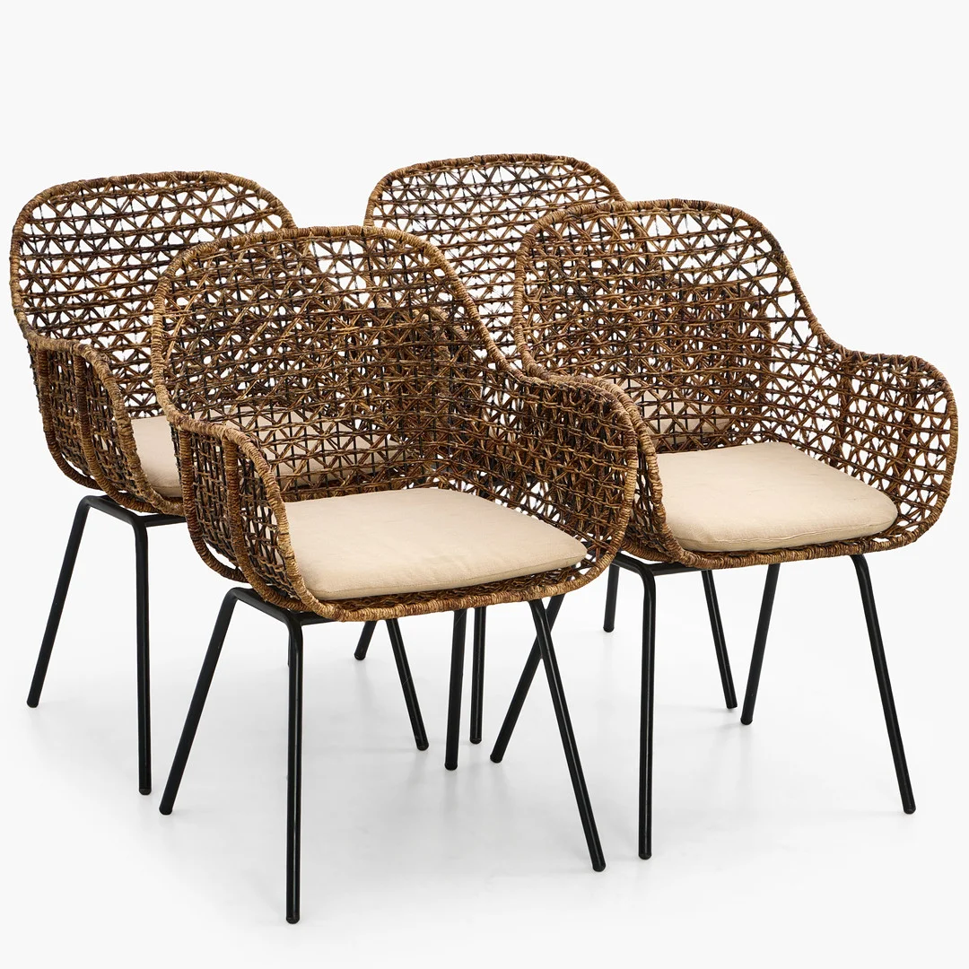 DIS INREDNING. Karmstolar, 4 st, sits i flätad rotting, benställning i svartlackerad metall. — Armchairs & Chairs — Crafoord Auktioner Stockholm
