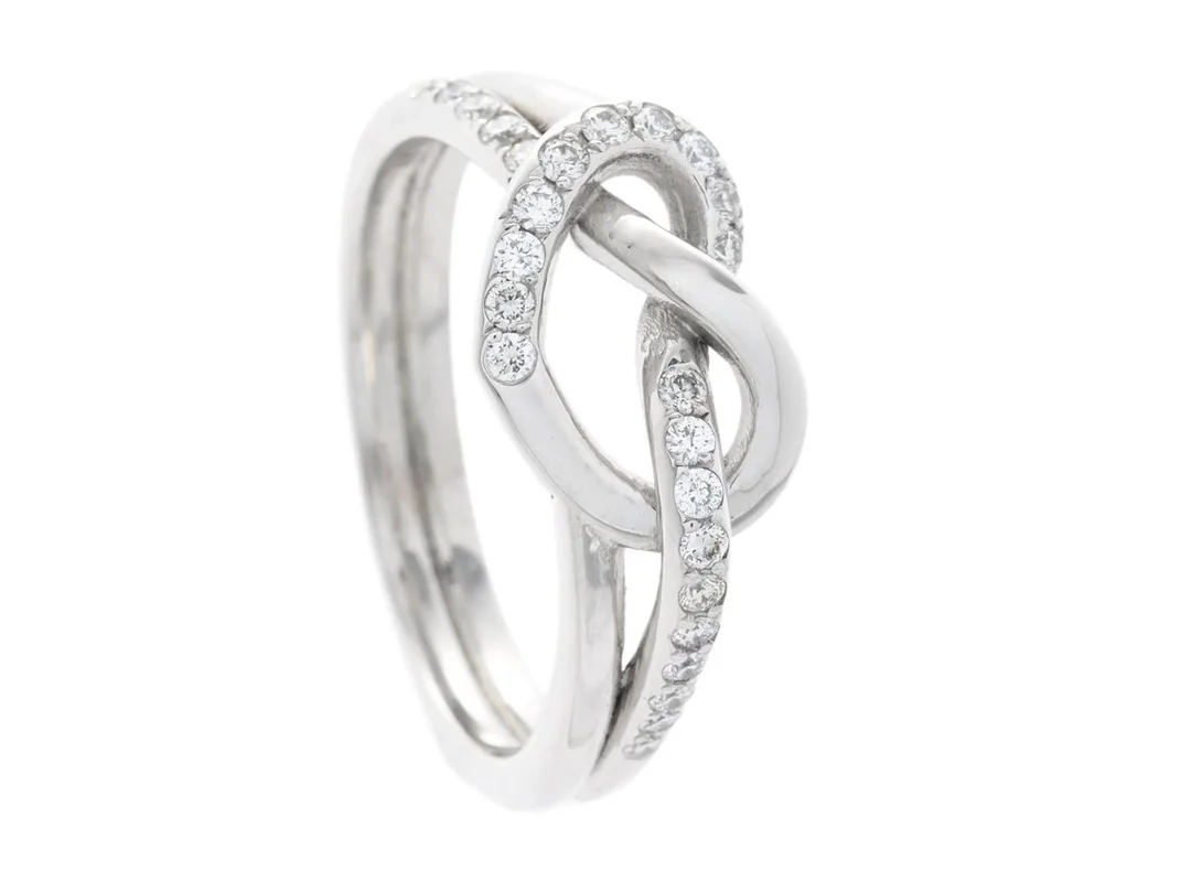 STRÖMDAHLS, ring, Love knot small, 18K vitguld, briljantslipade diamanter 0,22 ctv, TW/VS-SI, stl 17,5 mm, vikt 5,7 g. — Smycken/Ring — Kaplans