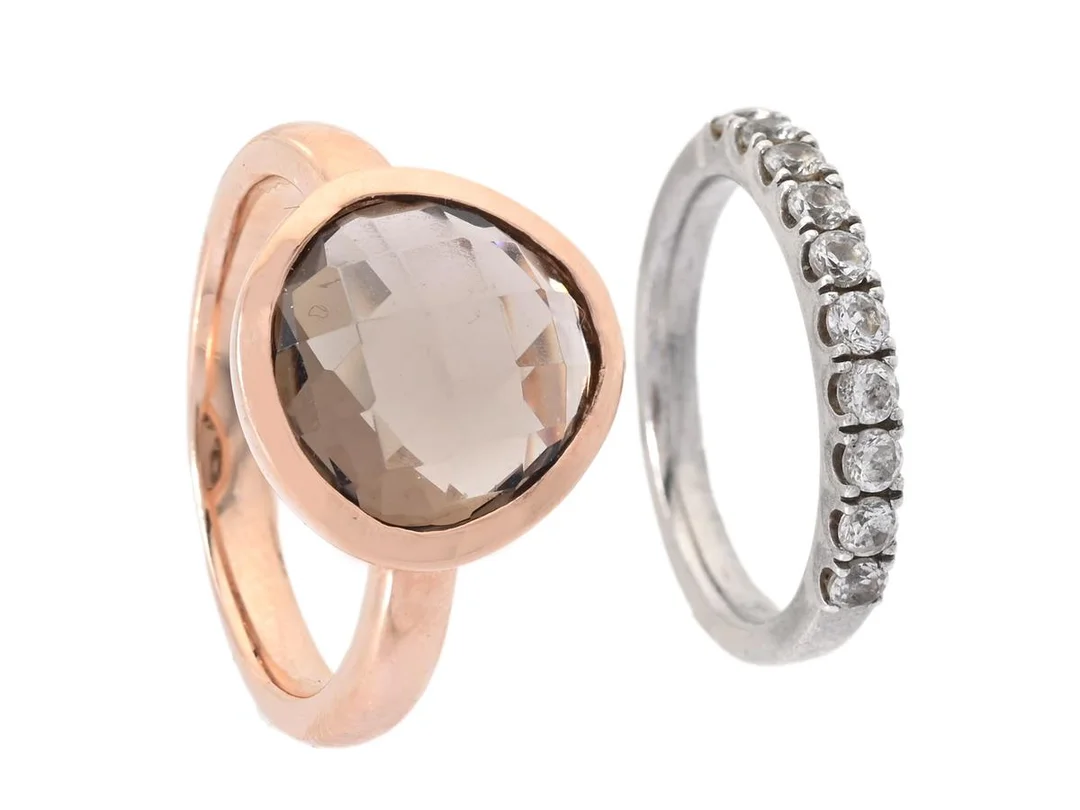 SMYCKESET, 2 st ringar, sterlingsilver/förgyllt sterlingsilver, cubic zirconia, rökkvarts, stl 18/16,25 mm, vikt ca 8,2 g. — Smycken/Smyckeset — Kaplans