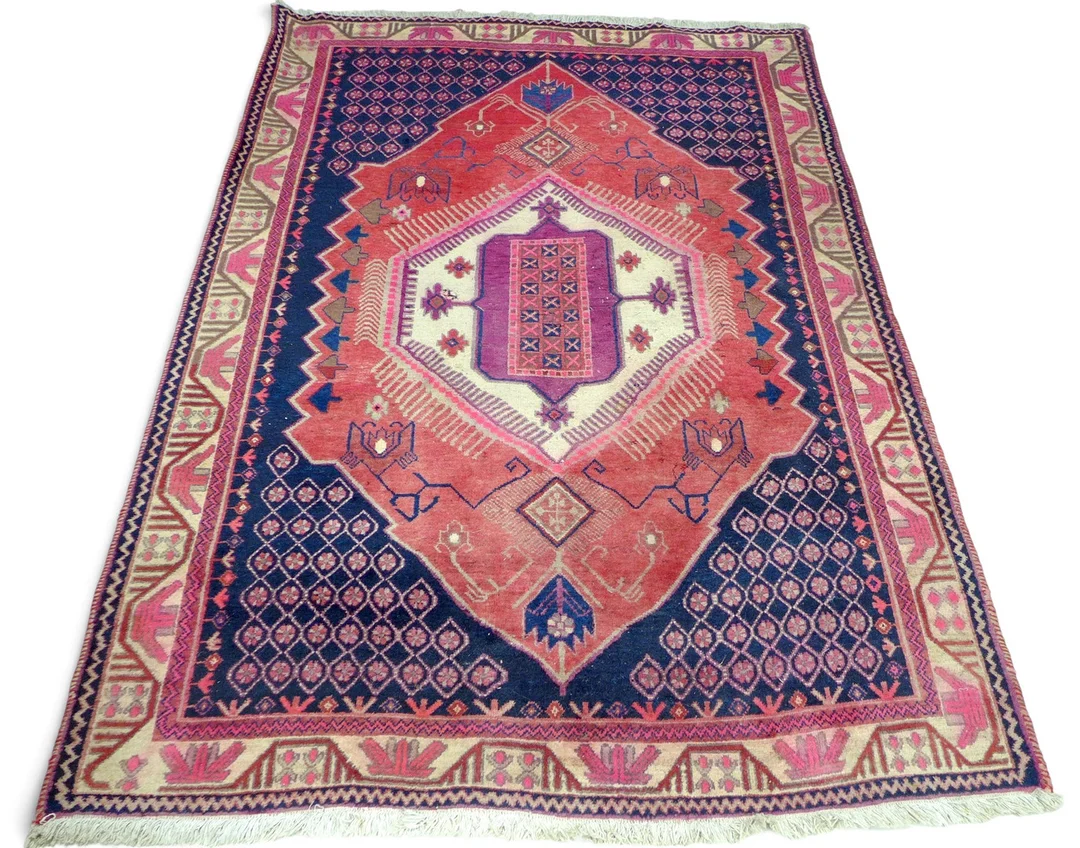 A HAND KNOTTED WOOLEN RUG. — Carpets — Batemans of Stamford