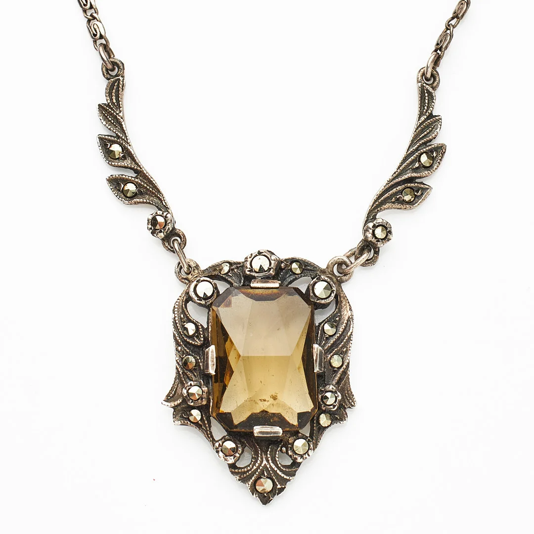 HALSBAND, silver, dekor med markasiter samt rökfärgad fantasislipad glassten, ca 1930-tal, svensk kontrollstämpel. — Bracelets — Stockholms Auktionsverk Magasin 5