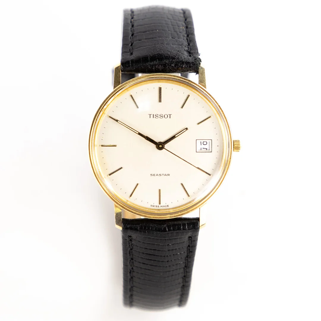 TISSOT, Seastar , quartz, 14k guld, 33,5 mm. — Wristwatches — Karljohan Auktioner