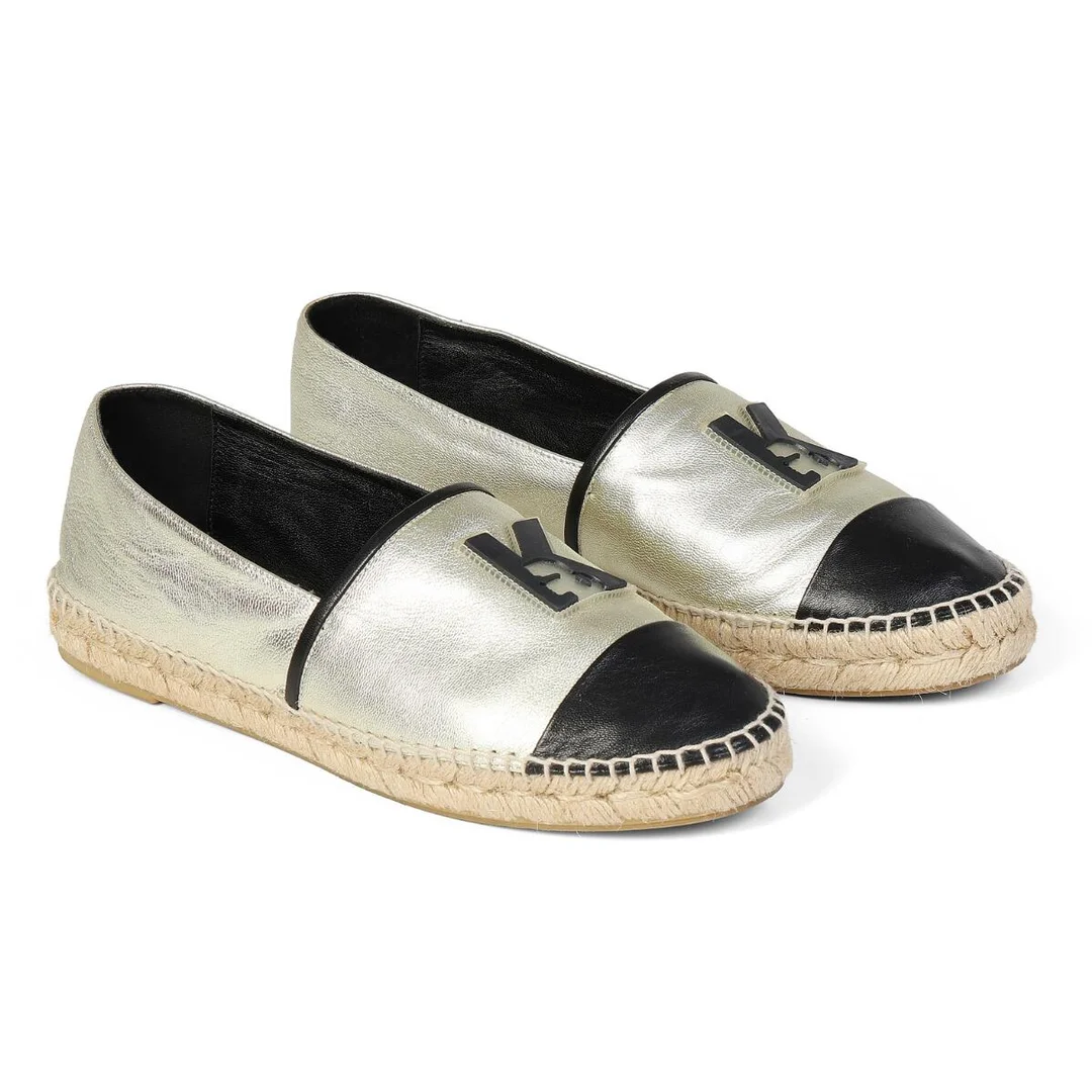 A pair of espadrilles of gold and black leather with logo on the front. Size 40. (2) — Designer Handbags & Fashion/Footwear — Bruun Rasmussen