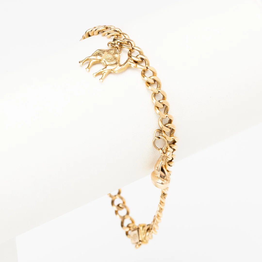 ARMBAND 18K guld med två berlocker 14K/18K guld, Ge-Kå Kaplans, Stockholm, 1967. — Bracelets — Auktionshuset Kolonn
