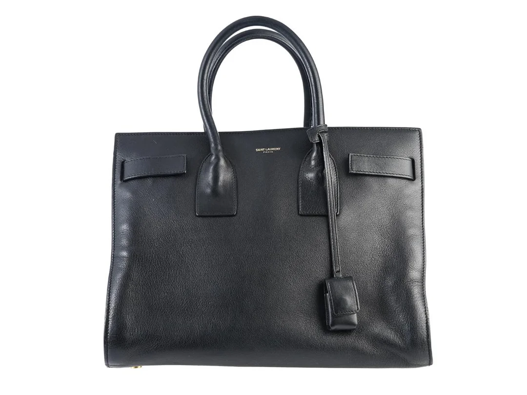 VÄSKA, SAINT LAURENT, Sac Du Jour, svart läder, guldfärgade beslag, 32x24x15 cm, avtagbar axelrem, lite slitage. — Accessoarer/Väskor — Kaplans