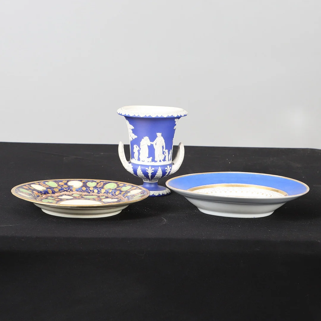 A 19TH CENTURY WEDGWOOD JASPERWARE CAMPANA URN, A 19TH CENTURY ENGLISH GILT PAINTED CREAMWARE DISH, AND A 19TH CENTURY FRENCH GILT & FLORAL PAINTED DISH (3). — European — Lawrences Auctioneers