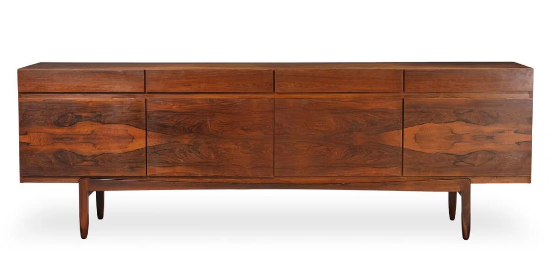 Ib Kofod-Larsen: A rosewood sideboard, front with four drawers and four doors. Model FA 66. H. 77. W. 230. D. 50 cm. — Modern Furniture — Bruun Rasmussen