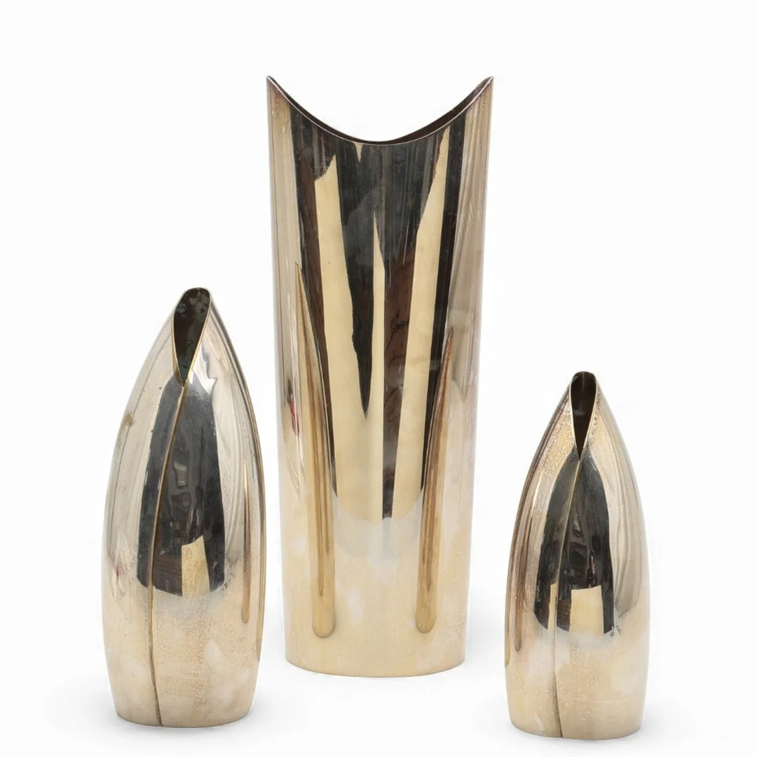 GUIDO NIEST. Two “F.A.L.A” vases and a “Miss Tingo” vase in silvery metal, circa 1980 and 1986. — Other metals — Balclis
