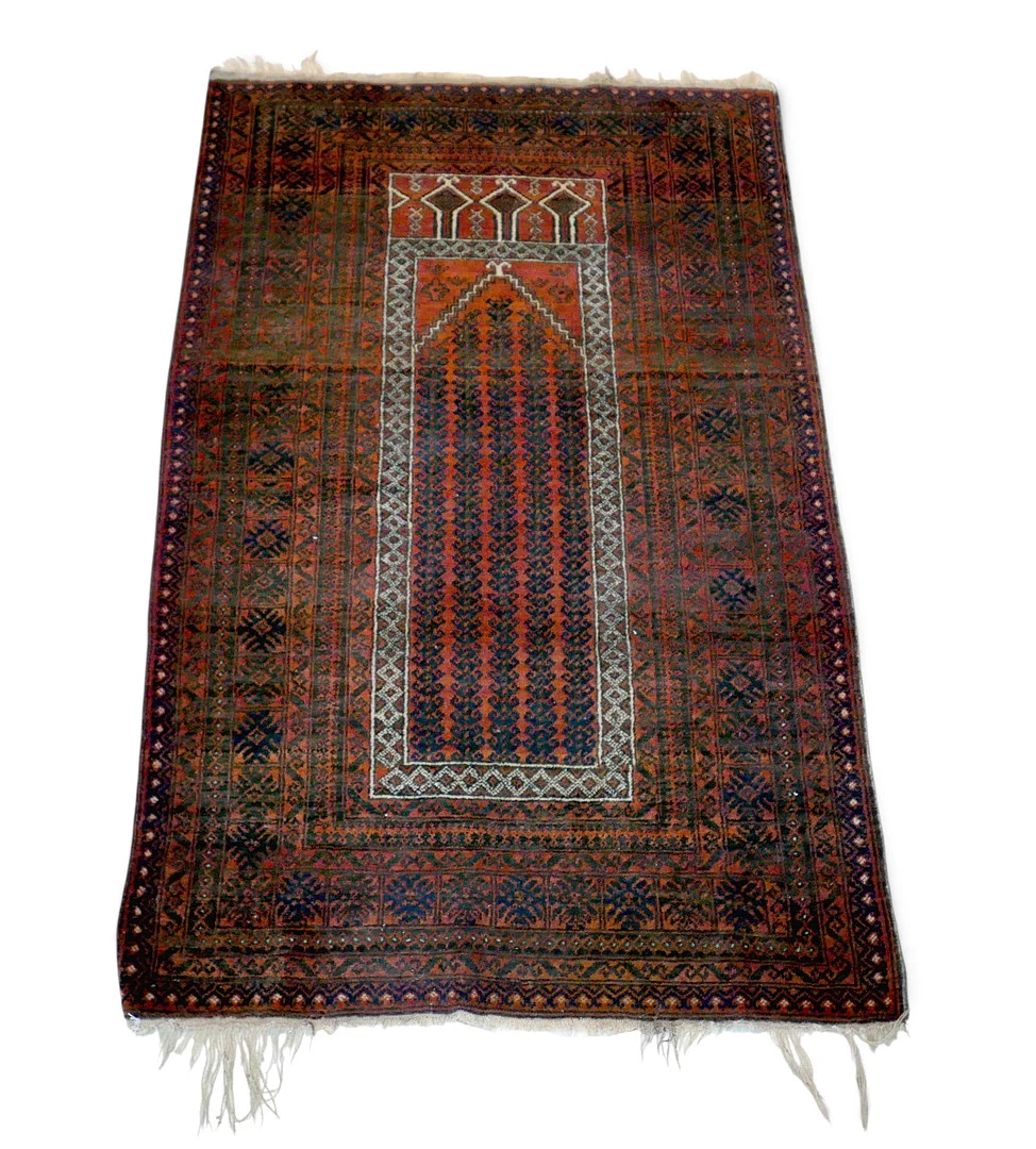 A HAND KNOTTED WOOLEN PRAYER RUG. — Carpets — Batemans of Stamford