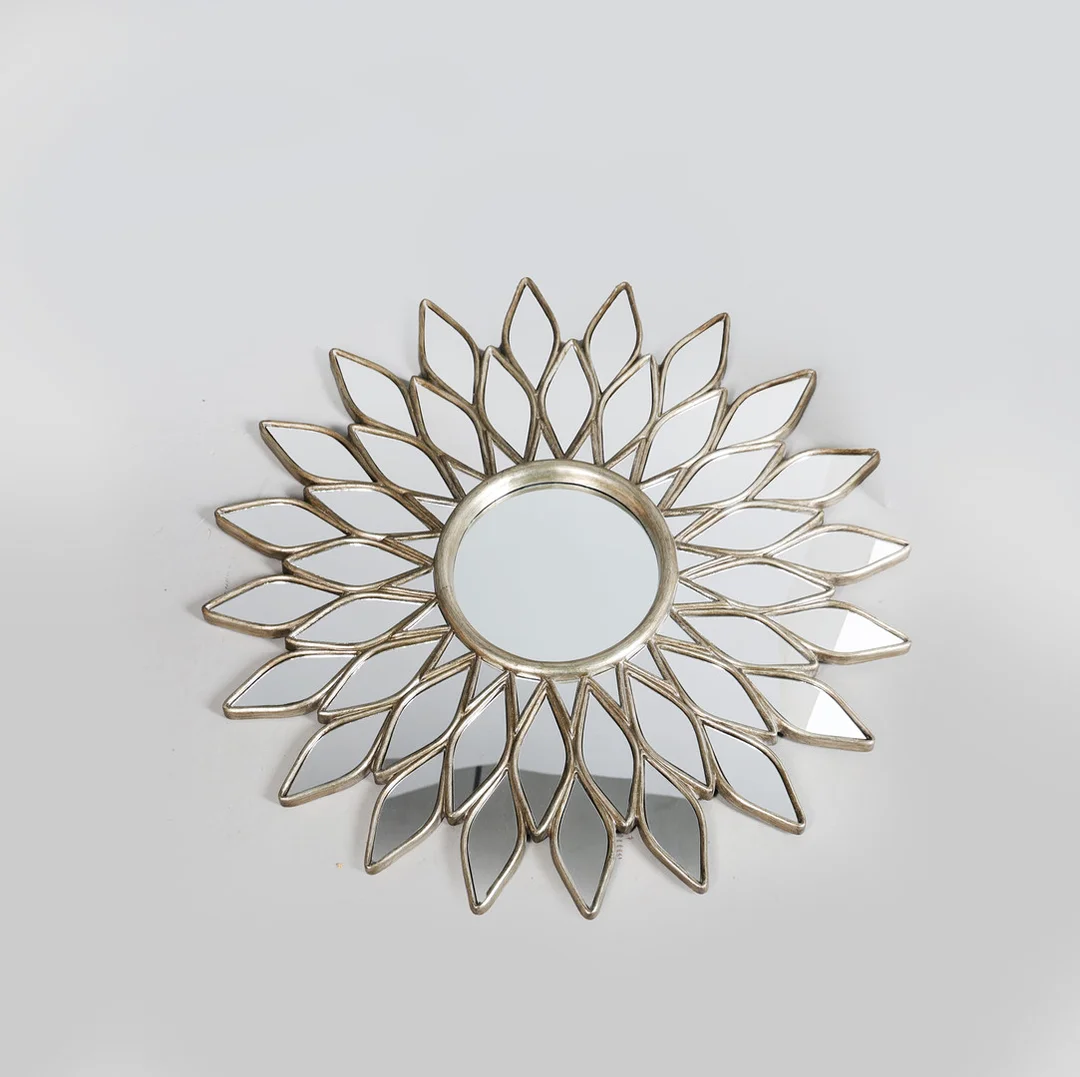 A SUNBURST/STAR WALL MIRROR. — Mirrors — Bishop & Miller