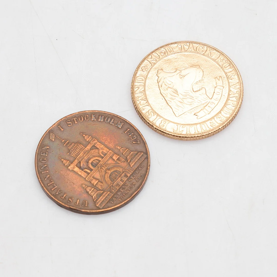 MINNESMYNT, 2 st, "Regalskeppet Wasa, 1960" & "Utställningen Stockholm 1897". — Coins & Banknotes — Gomér & Andersson Norrköping