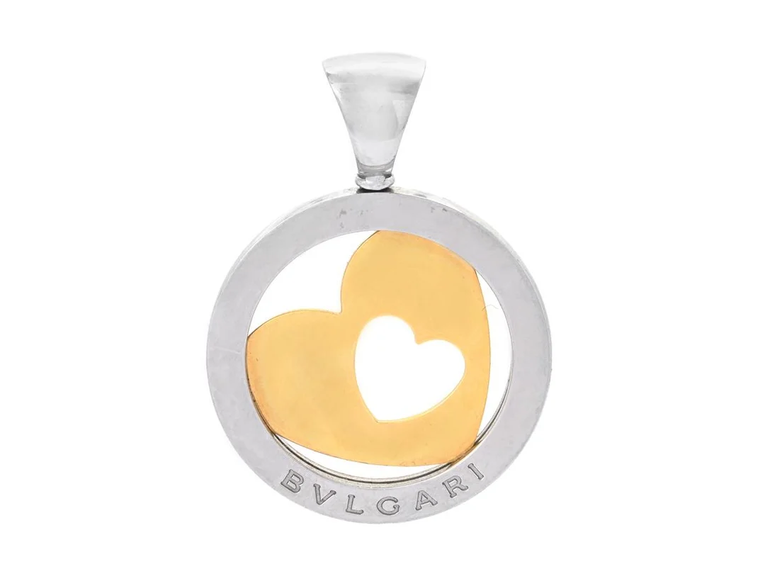 BVLGARI, hänge, Tondo Heart Pendant, 18K guld/stål, höjd 44 mm, diameter 30 mm, vikt 11,7 g. — Smycken/Hänge — Kaplans
